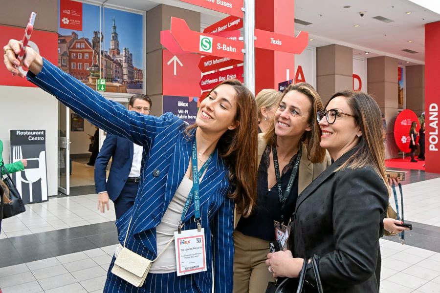 Three women taking selfie