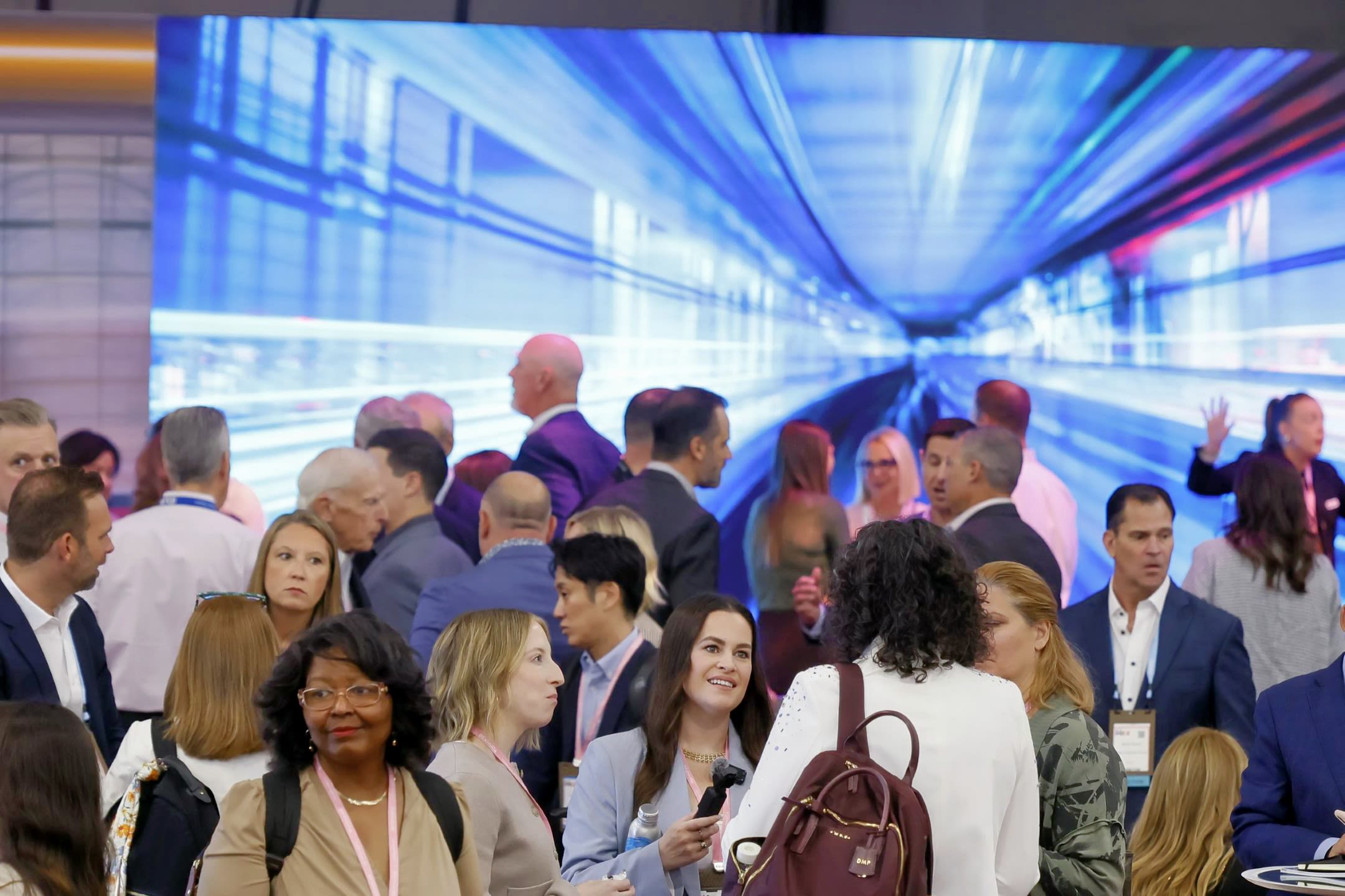 People in front of digital display.