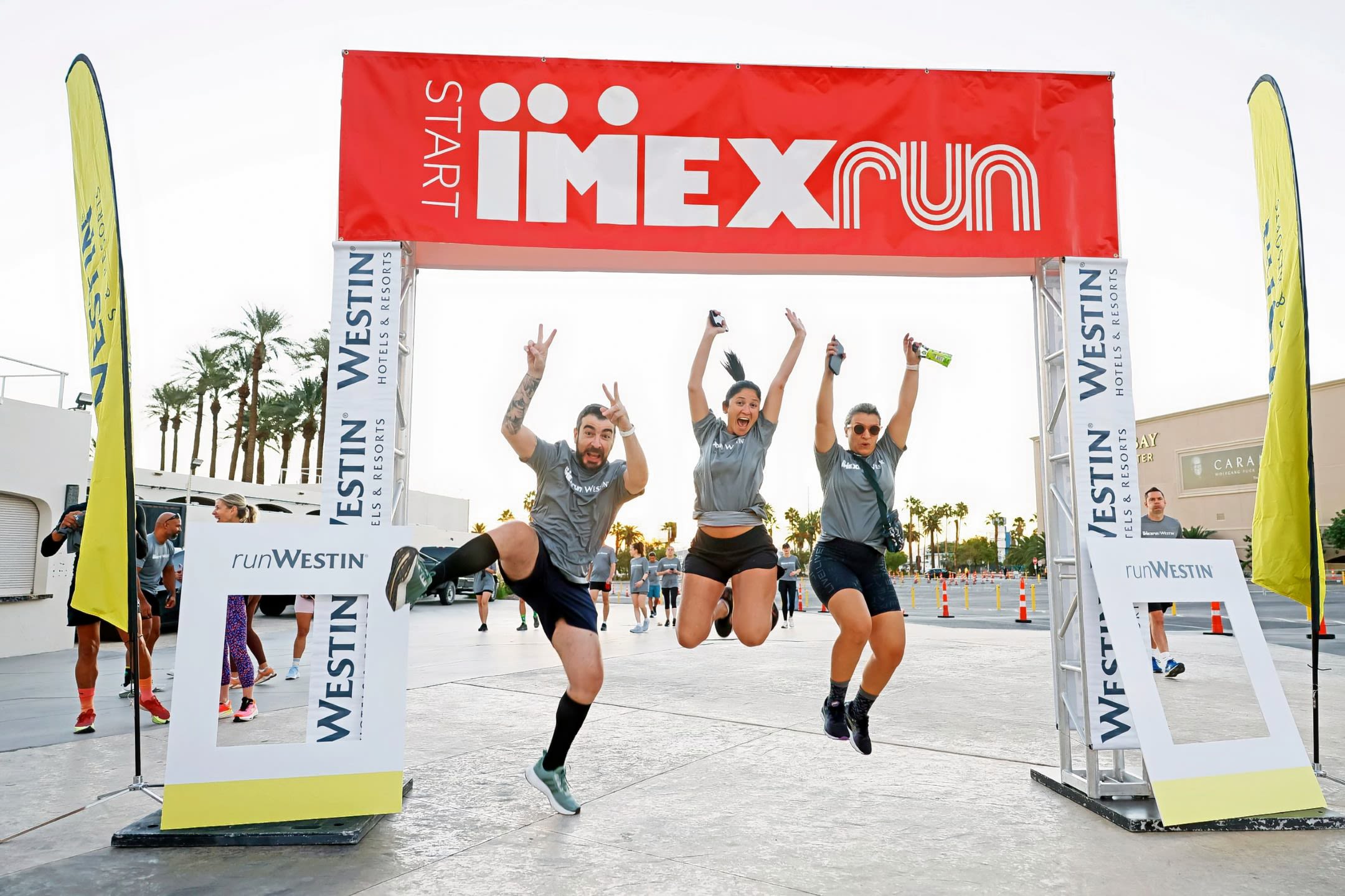 Three people leaping in air